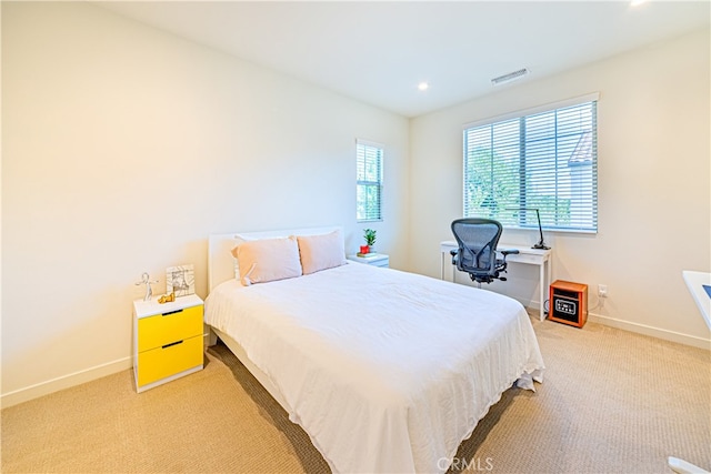 bedroom with light carpet