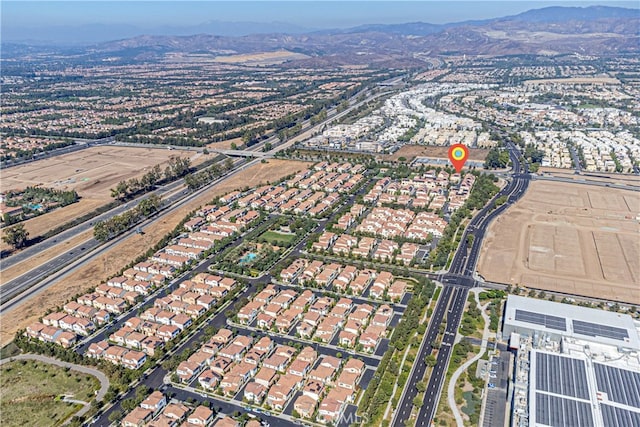 birds eye view of property with a mountain view