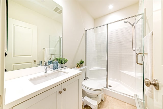 bathroom with walk in shower, vanity, tile patterned flooring, and toilet