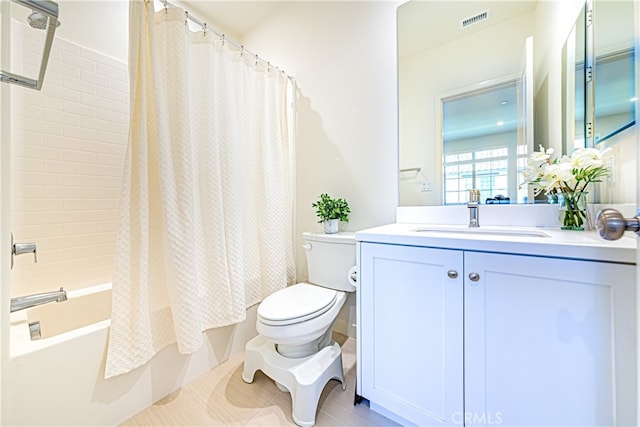 full bathroom featuring shower / bathtub combination with curtain, tile patterned floors, vanity, and toilet