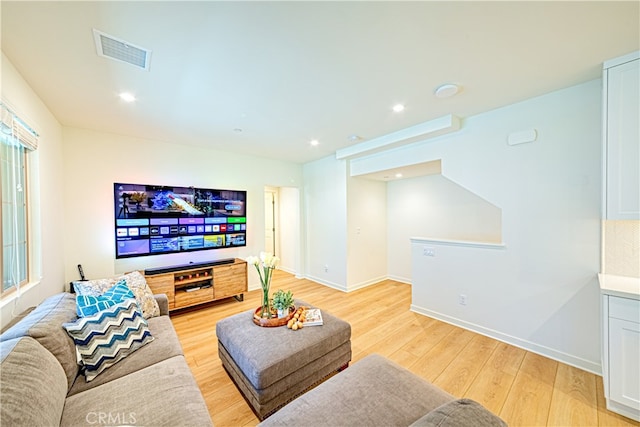 living room with light hardwood / wood-style flooring