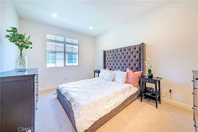 bedroom with light carpet