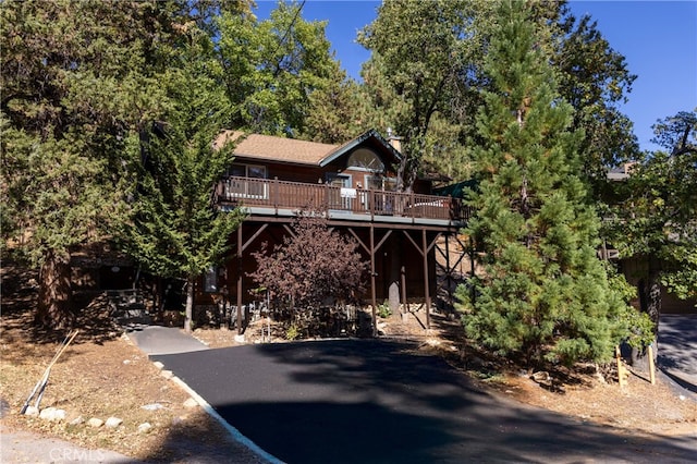 view of front facade with a wooden deck