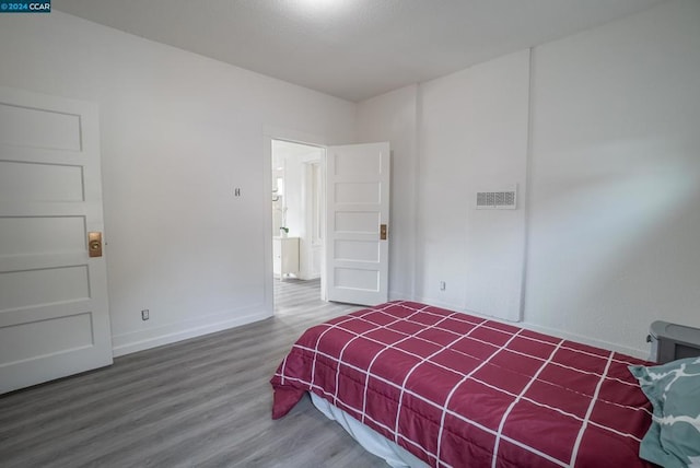 bedroom featuring hardwood / wood-style flooring