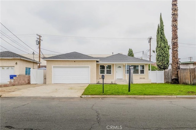 ranch-style home with a front yard and a garage