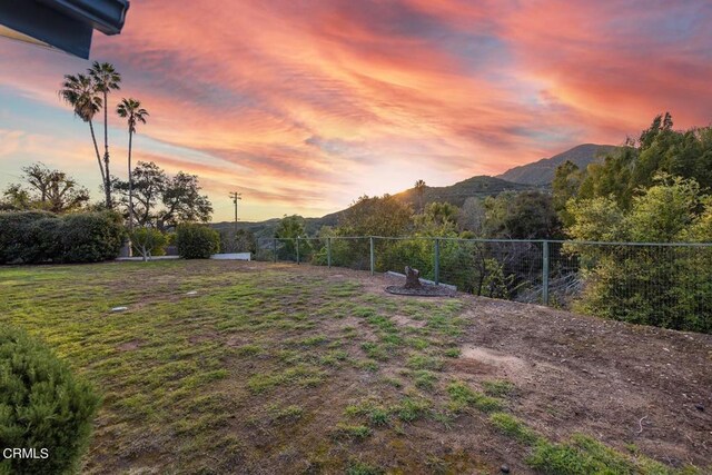 yard at dusk with a mountain view