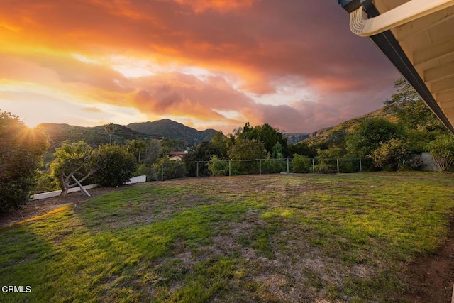 yard at dusk with a mountain view