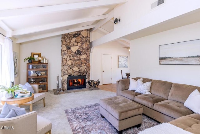 living room with a fireplace, vaulted ceiling with beams, and ceiling fan