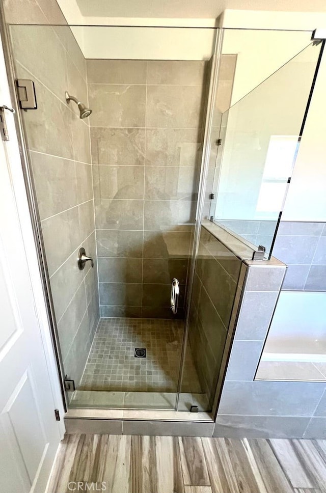 bathroom with an enclosed shower