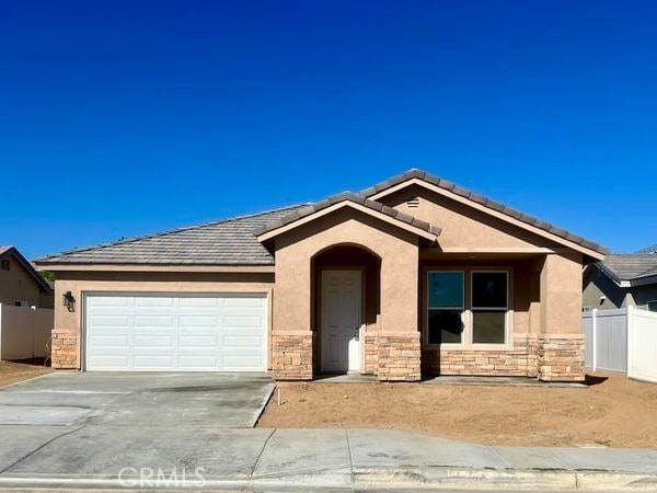 single story home featuring a garage