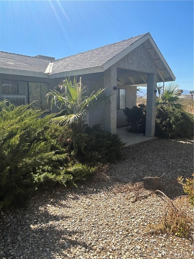 view of side of property featuring central AC unit