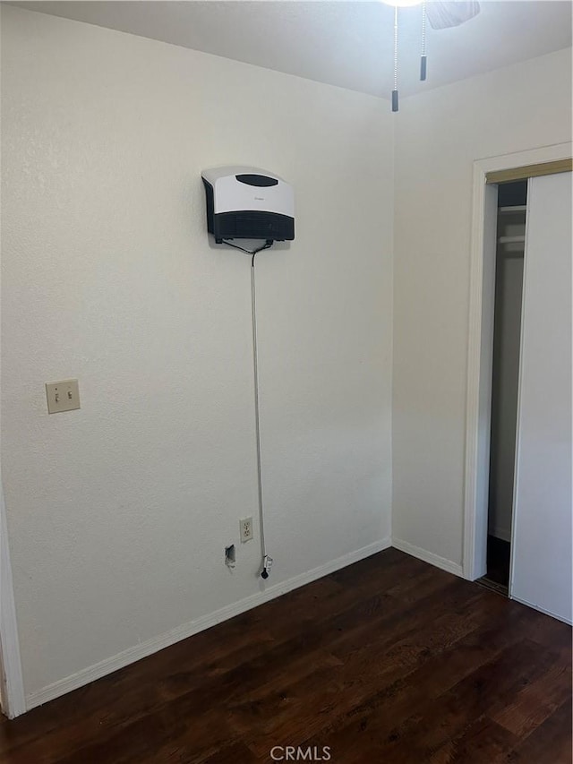 interior space featuring a closet and dark wood-type flooring