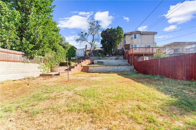 view of yard with a deck