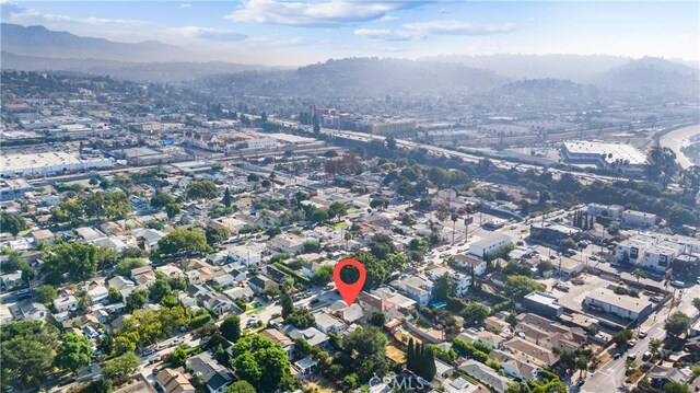 birds eye view of property with a mountain view