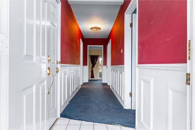 corridor with light tile patterned flooring