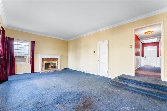 unfurnished living room with dark carpet, cooling unit, a fireplace, and ornamental molding