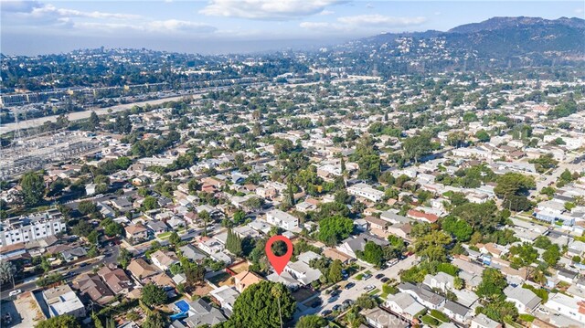 birds eye view of property with a mountain view