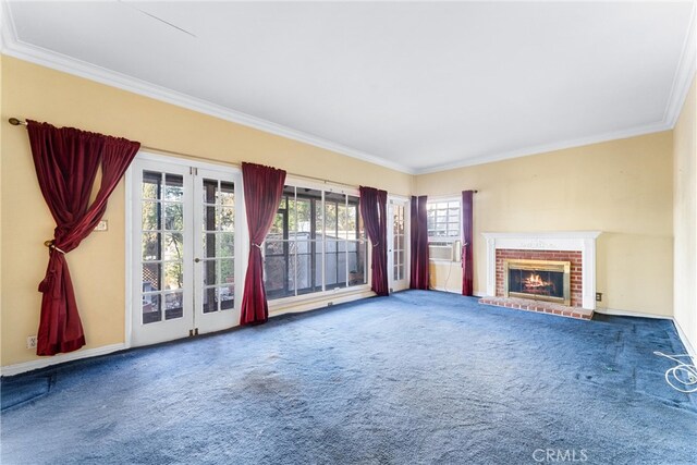 unfurnished living room with a brick fireplace, carpet flooring, and ornamental molding