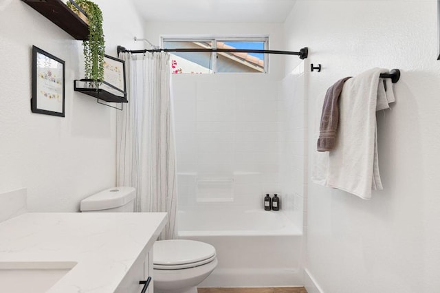 full bathroom featuring vanity, shower / bath combo, and toilet