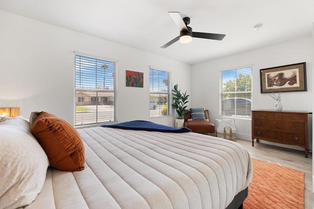 bedroom featuring ceiling fan and light wood-type flooring