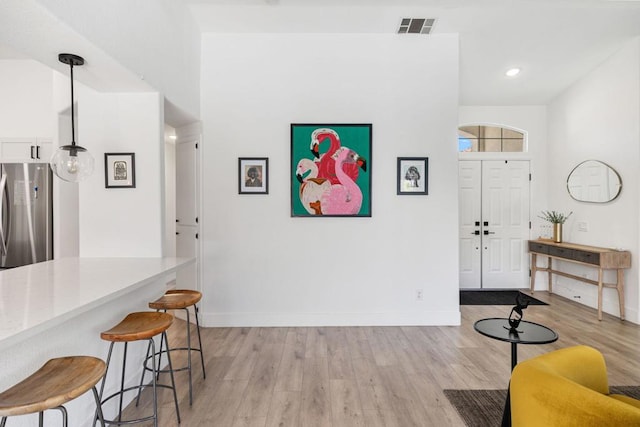 entrance foyer featuring light hardwood / wood-style floors