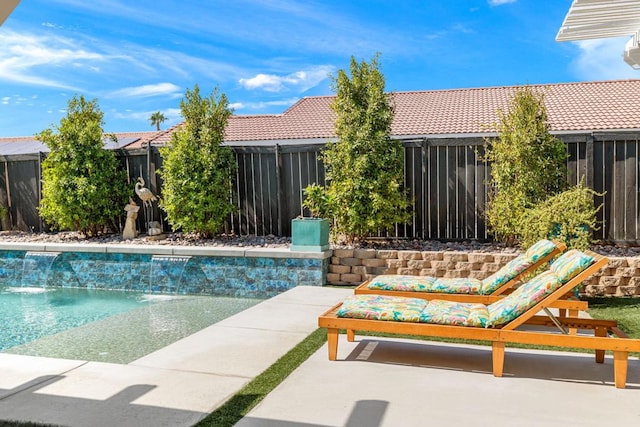 view of swimming pool featuring a patio area and pool water feature