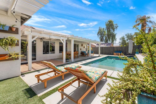 view of pool with a pergola and a patio area