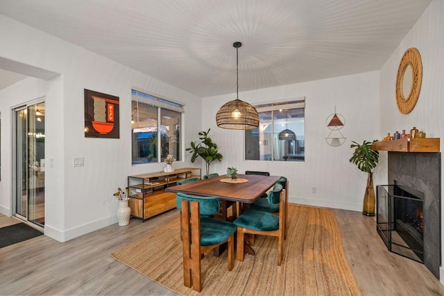 dining space featuring light wood-type flooring