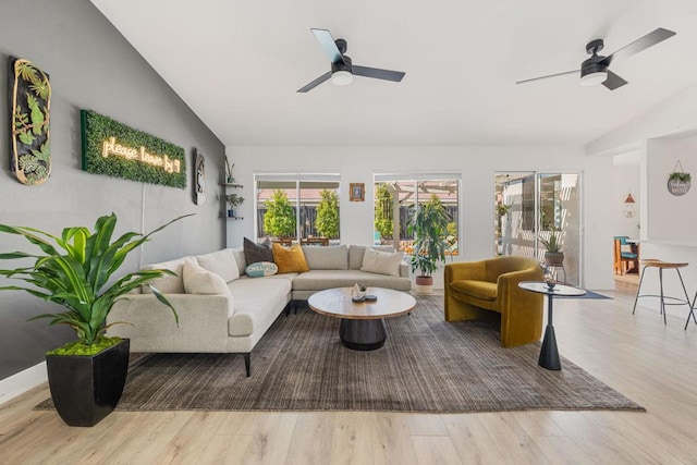 sunroom featuring ceiling fan and vaulted ceiling