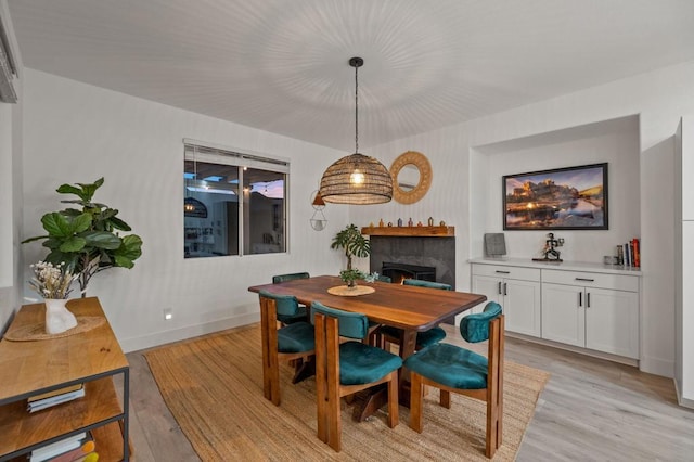 dining space with light hardwood / wood-style flooring