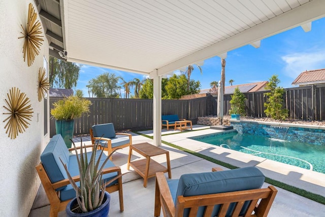 view of swimming pool with pool water feature and a patio