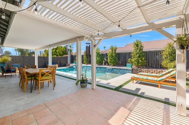 view of pool featuring pool water feature, a pergola, and a patio