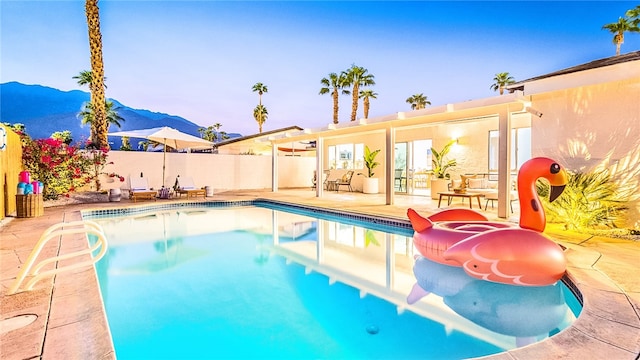 921 Arroyo Vista Dr, Palm Springs, CA 92264 - view of pool featuring a fenced in pool, fence, a mountain view, and a patio area