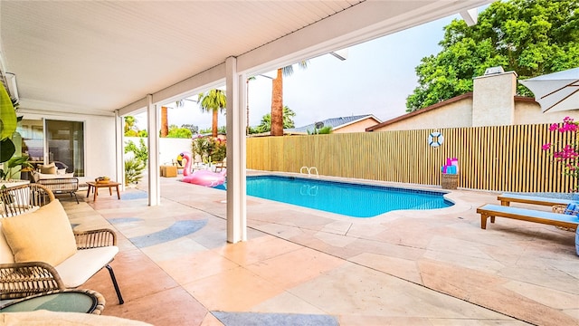 view of pool featuring a patio