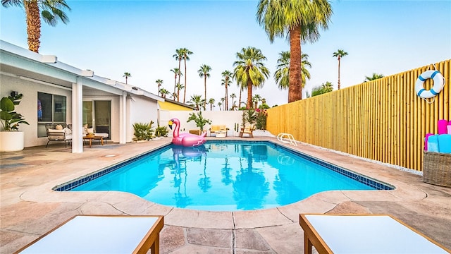 view of swimming pool with a patio