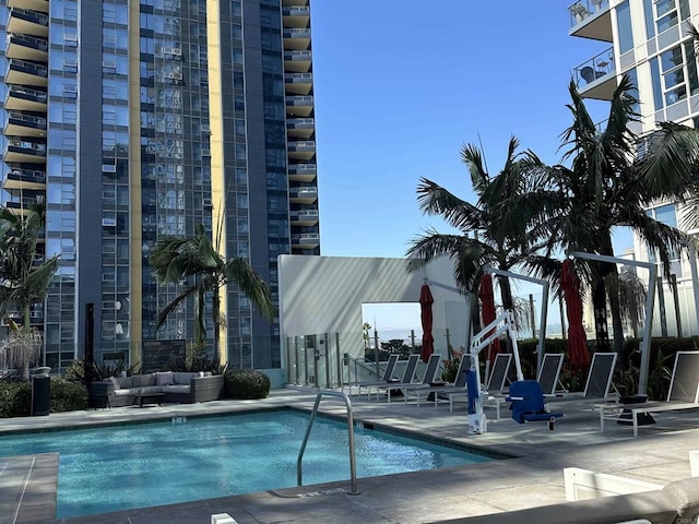 view of pool with a patio and outdoor lounge area