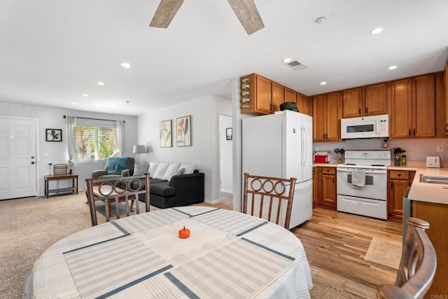 dining area featuring ceiling fan and light hardwood / wood-style flooring