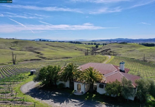 bird's eye view featuring a rural view and a mountain view