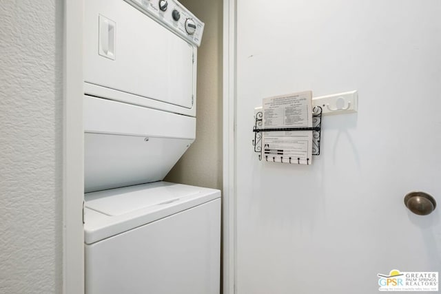 laundry room featuring stacked washer and clothes dryer