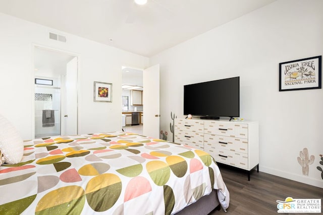 bedroom featuring dark hardwood / wood-style floors and ensuite bath