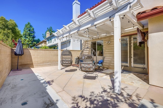 view of patio / terrace featuring a pergola and french doors