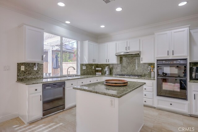 kitchen featuring light stone counters, white cabinetry, a kitchen island, and black appliances