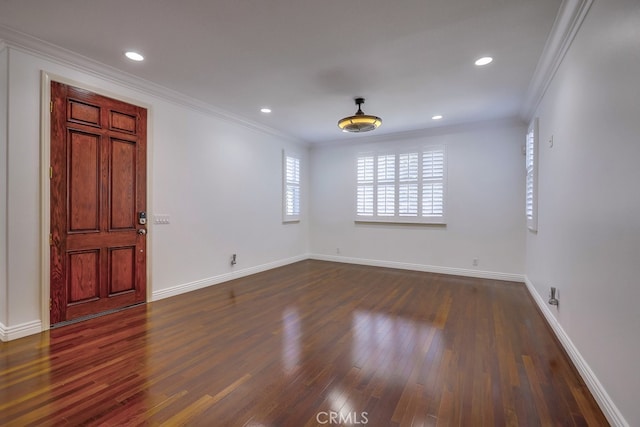 foyer entrance featuring dark hardwood / wood-style flooring and crown molding