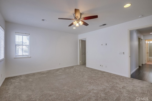 carpeted empty room with ceiling fan