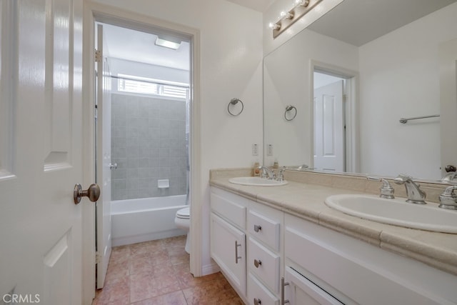 full bathroom featuring tile patterned floors, vanity, toilet, and shower / washtub combination