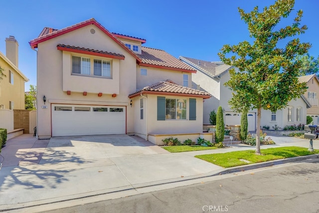 mediterranean / spanish-style home featuring a garage