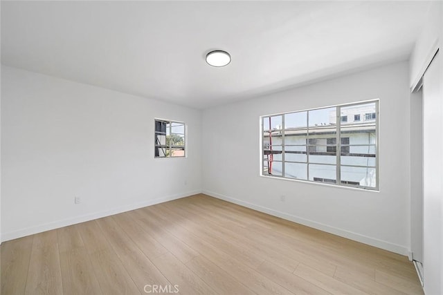 unfurnished room featuring light hardwood / wood-style floors