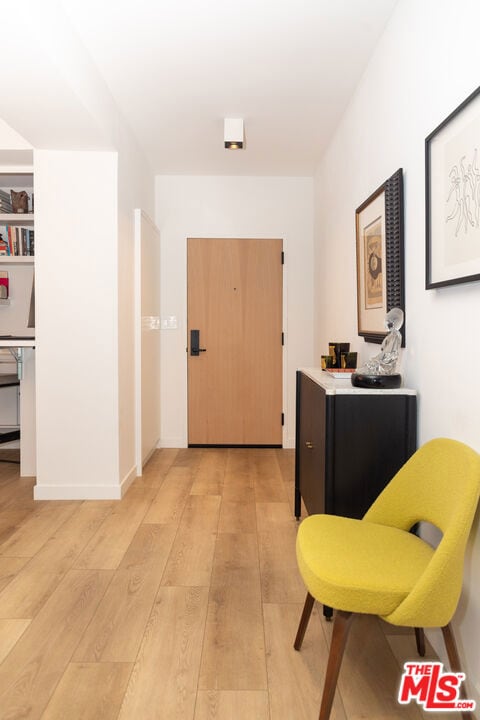 corridor featuring light hardwood / wood-style floors