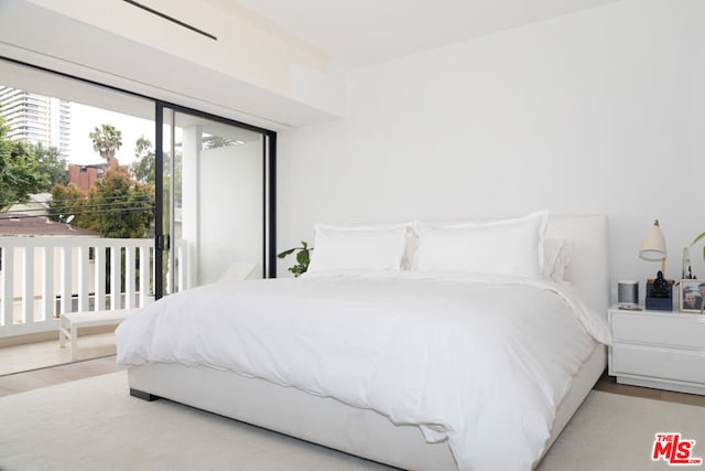 bedroom with light hardwood / wood-style floors