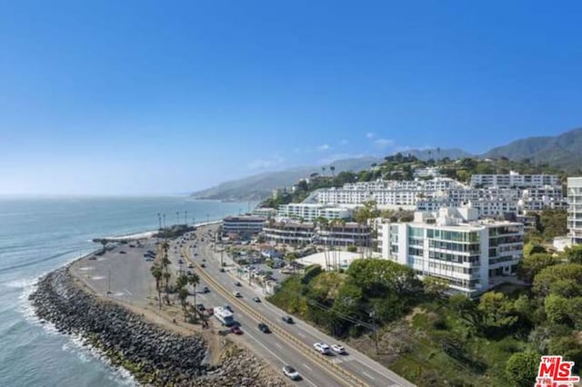 bird's eye view with a view of the beach and a water view